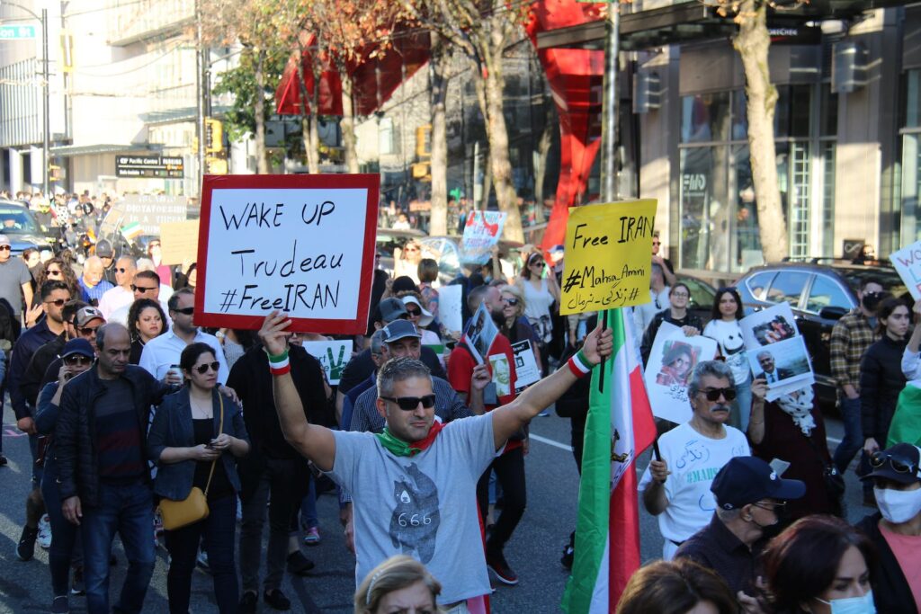 Protesters Walking on Street Holding Placards