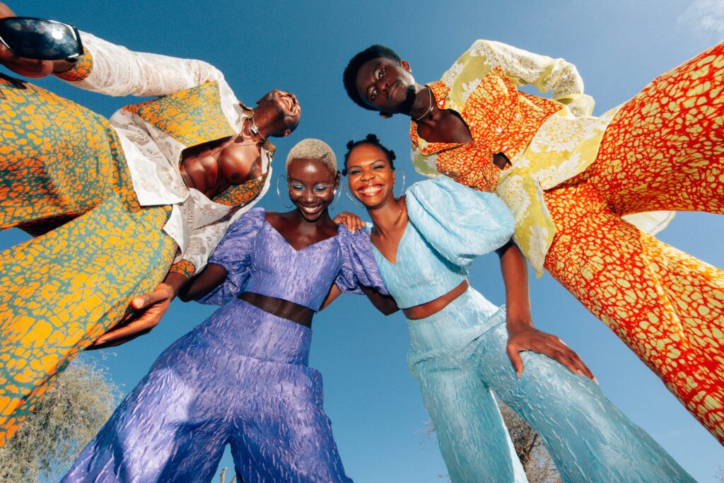 Low Angle View of Men and Women in Colorful Suits