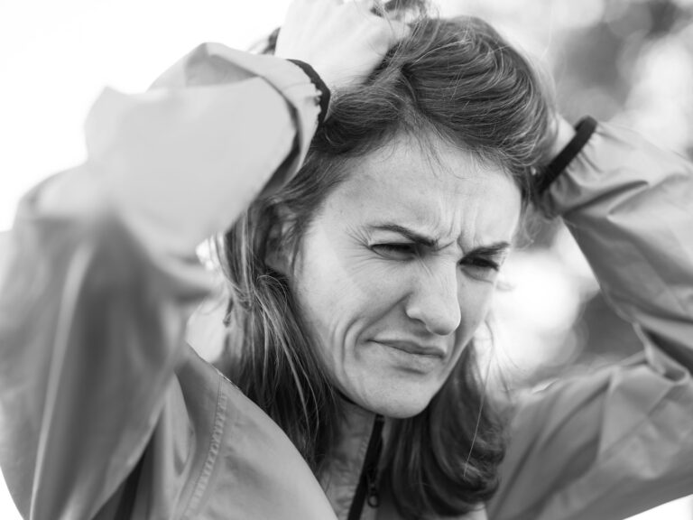 a woman holding her head in her hands